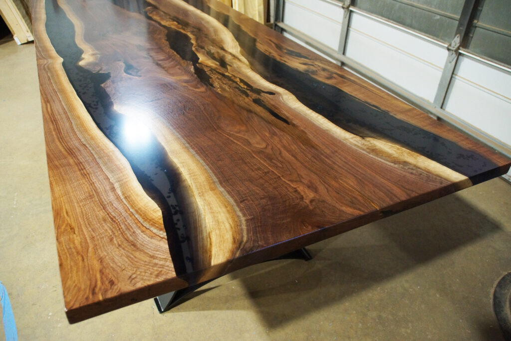 http://Walnut%20Dining%20Table%20With%20Translucent%20Black%20Epoxy%20River%20&%20Stones%202