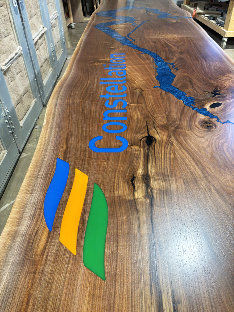 http://Live%20Edge%20Walnut%20Conference%20Table%20With%20Topography%20And%20Custom%20Logos%204