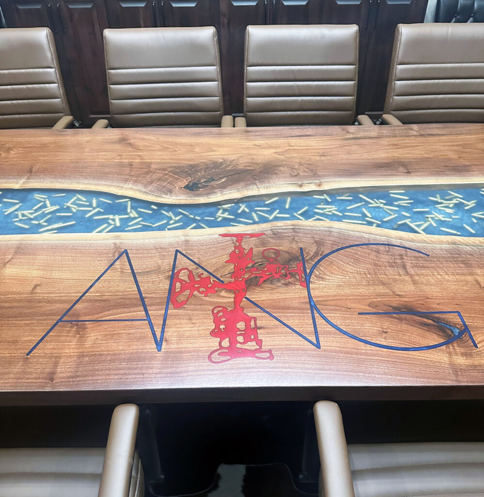 http://Walnut%20Conference%20Epoxy%20Table%20With%20Bullets%20Embedded%20&%20Engraved%20Logo%201919%2015