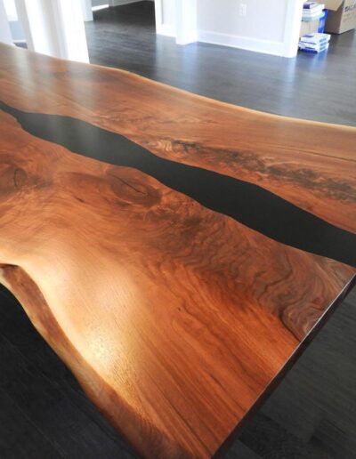 custom live edge dining table with black epoxy 2