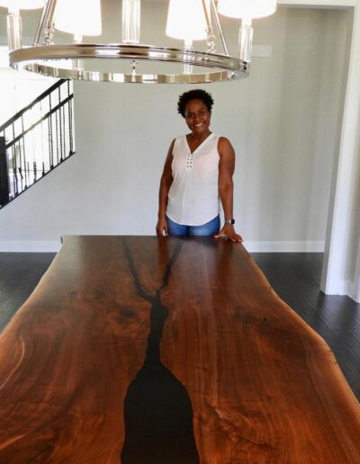 custom live edge dining table with black epoxy