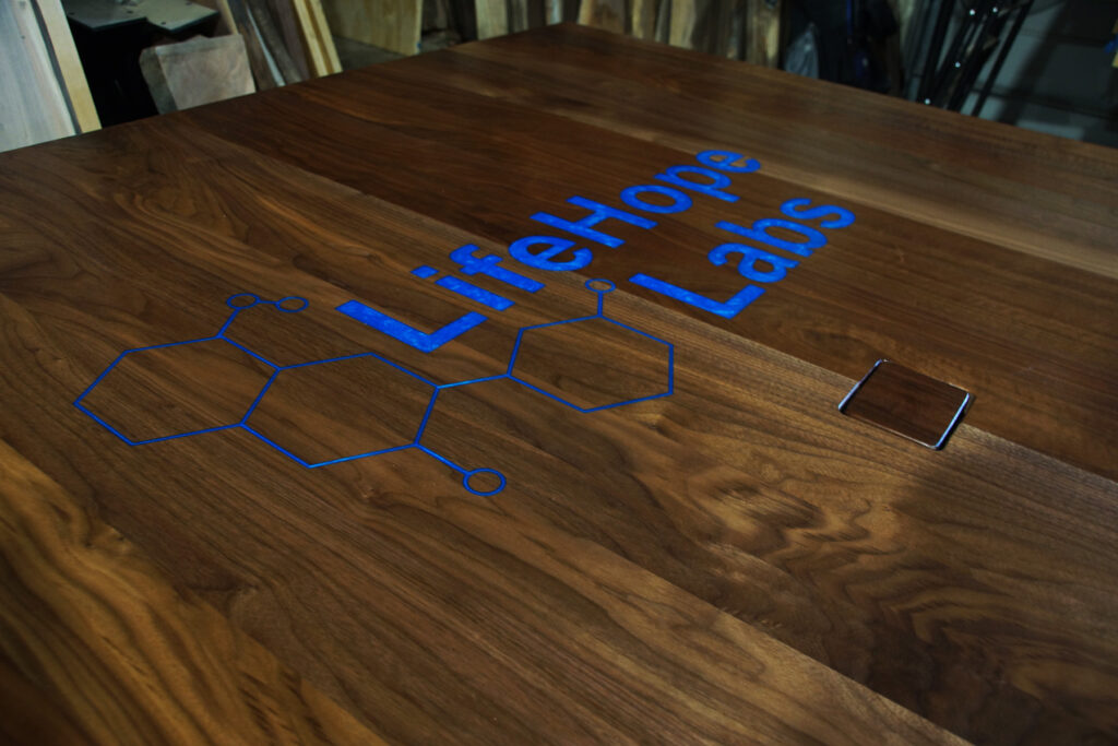 http://Walnut%20Plank%20Conference%20Table%20With%20CNC%20Logo%202