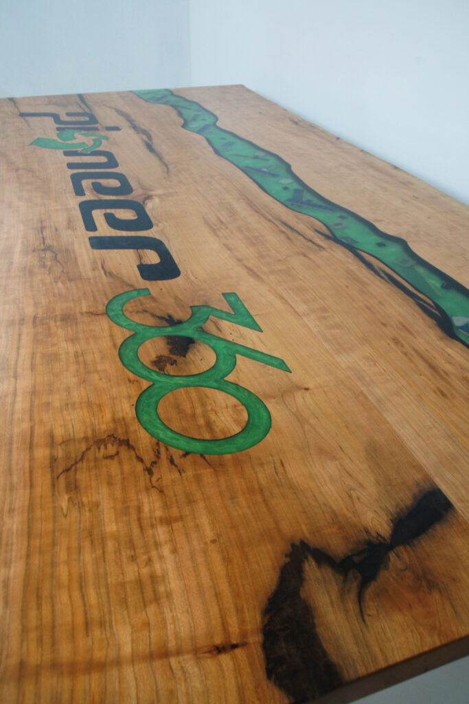 http://Epoxy%20River%20Conference%20Table%20with%20CNC%20Carved%20Logo%202
