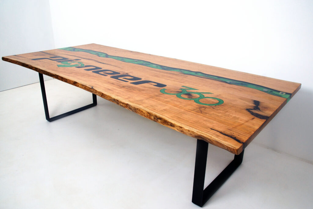 http://Epoxy%20River%20Conference%20Table%20with%20CNC%20Carved%20Logo%204