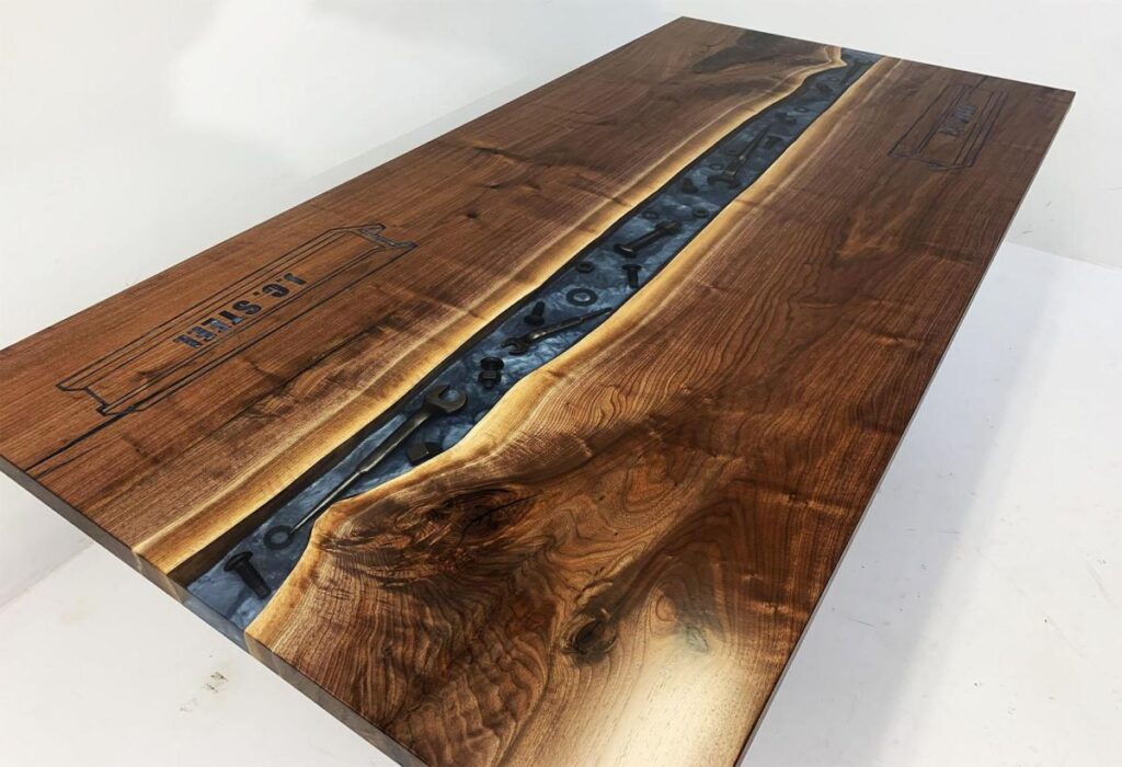 http://Walnut%20Conference%20River%20Table%20With%20Embedded%20Tools%20And%20CNC%20Logo%201