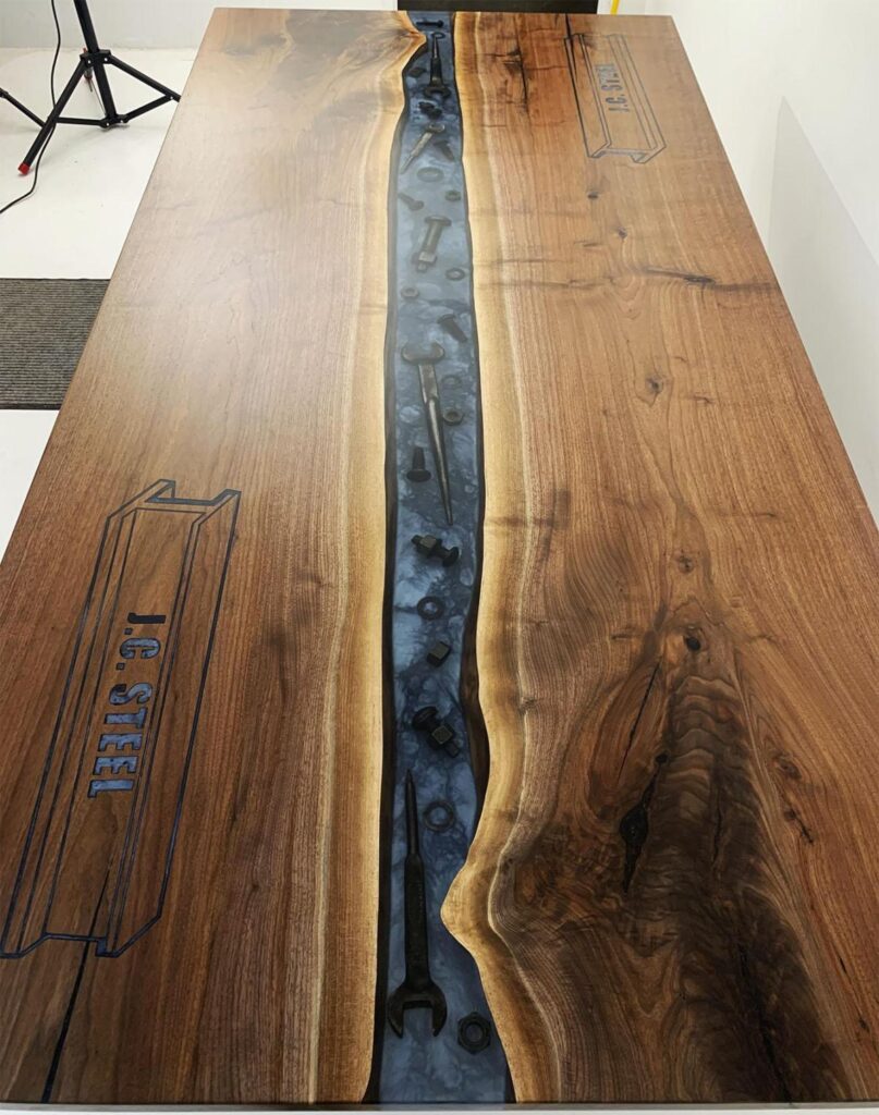 http://Walnut%20Conference%20River%20Table%20With%20Embedded%20Tools%20And%20CNC%20Logo%203