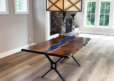 live edge dining room table with deep blue resin river 12
