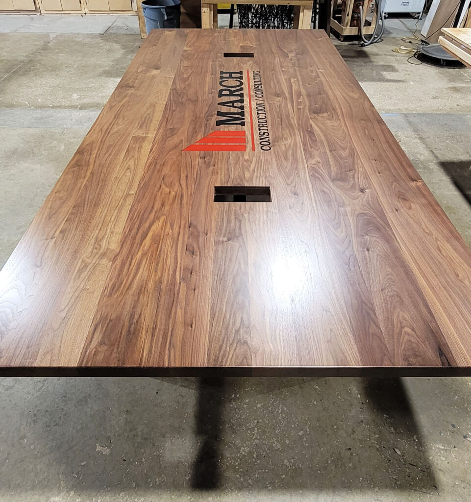http://Walnut%20Conference%20Table%20With%20CNC%20Logo%20And%20Cable%20Grommets%201