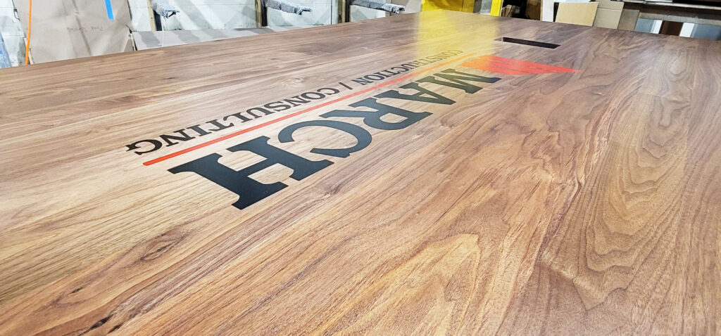 http://Walnut%20Conference%20Table%20With%20CNC%20Logo%20And%20Cable%20Grommets%204