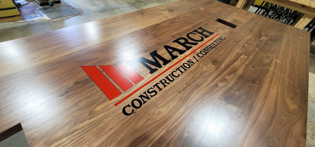 http://Walnut%20Conference%20Table%20With%20CNC%20Logo%20And%20Cable%20Grommets%205