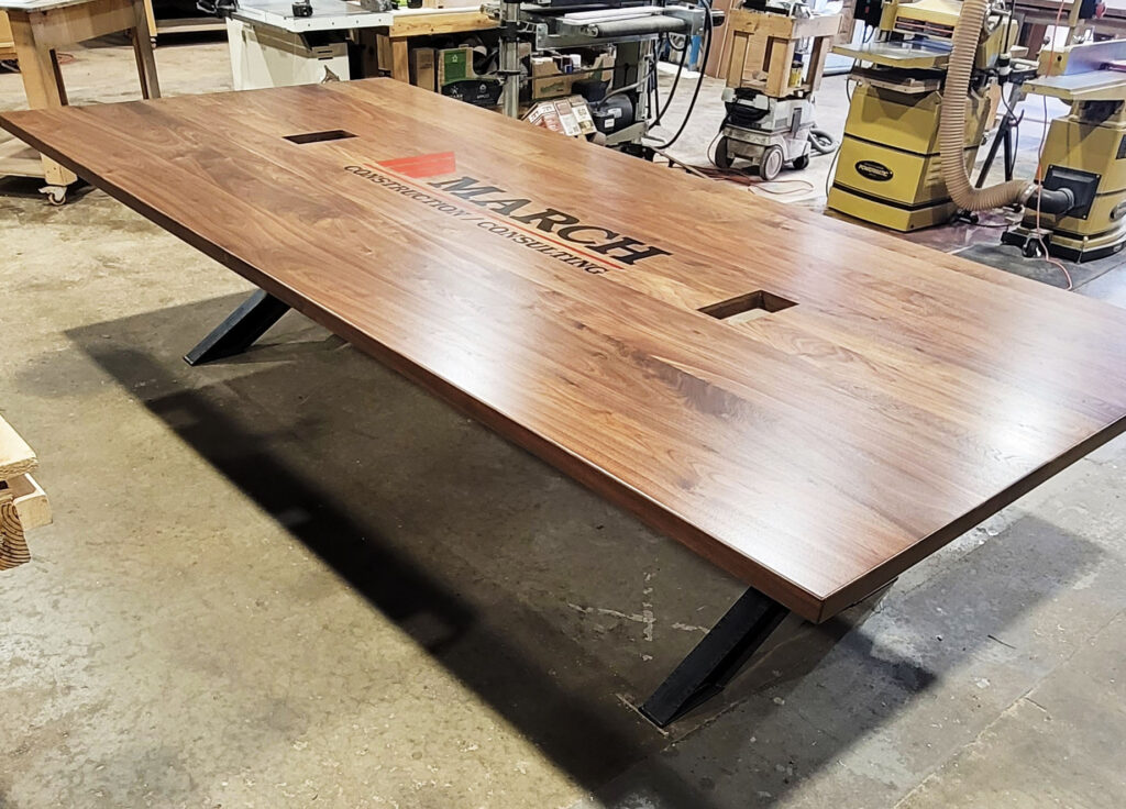 http://Walnut%20Conference%20Table%20With%20CNC%20Logo%20And%20Cable%20Grommets%206