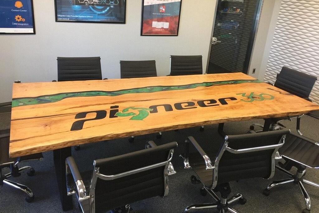 custom engraved conference table with epoxy filled logo embedded objects cnc engraved furniture
