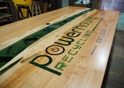 engraved conference table with epoxy filled cnc logo