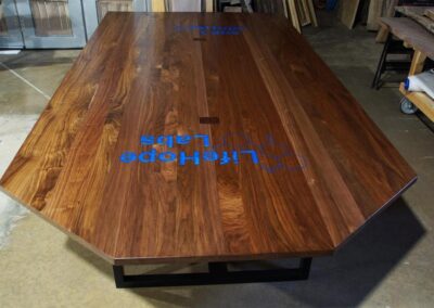 engraved conference table with epoxy filled logo cnc engraved wood